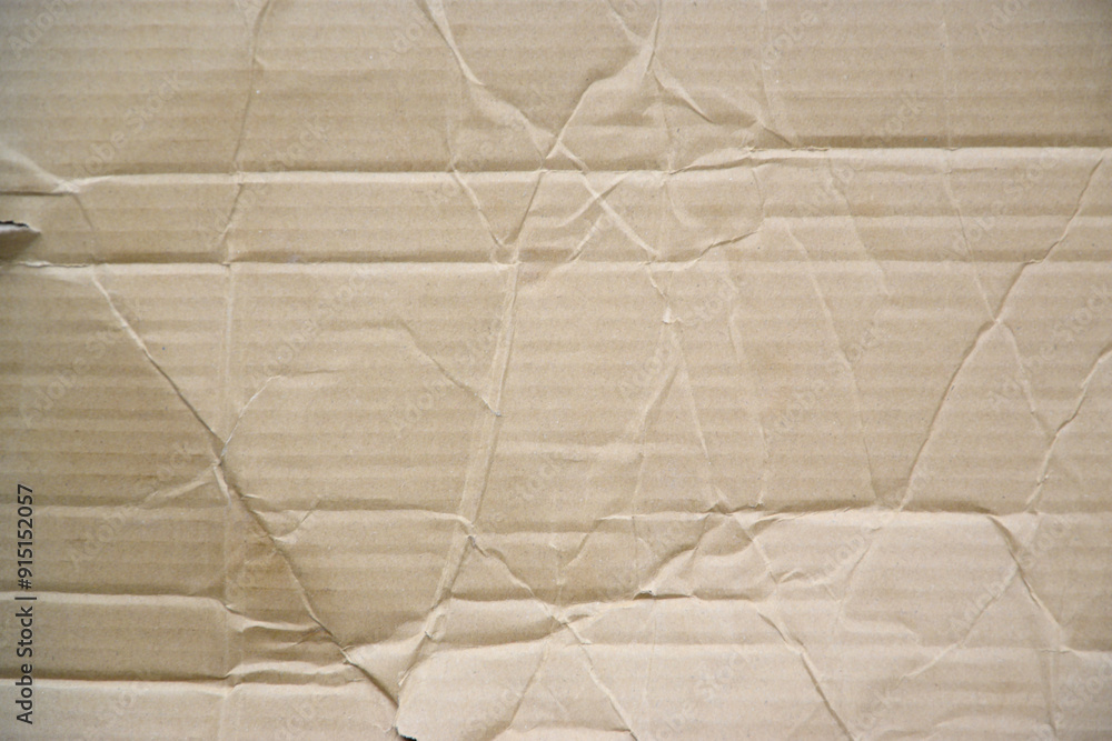 Craft crumpled paper, cardboard background. Brown kraft sheet texture, torn antique page, wallpaper or parchment abstract design, Horizontal rough carton Craft crumpled paper, cardboard background. Brown kraft sheet texture, torn antique page, wallpaper or parchment abstract design, Horizontal rough carton