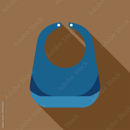 Blue baby bib lying on brown surface with long shadow