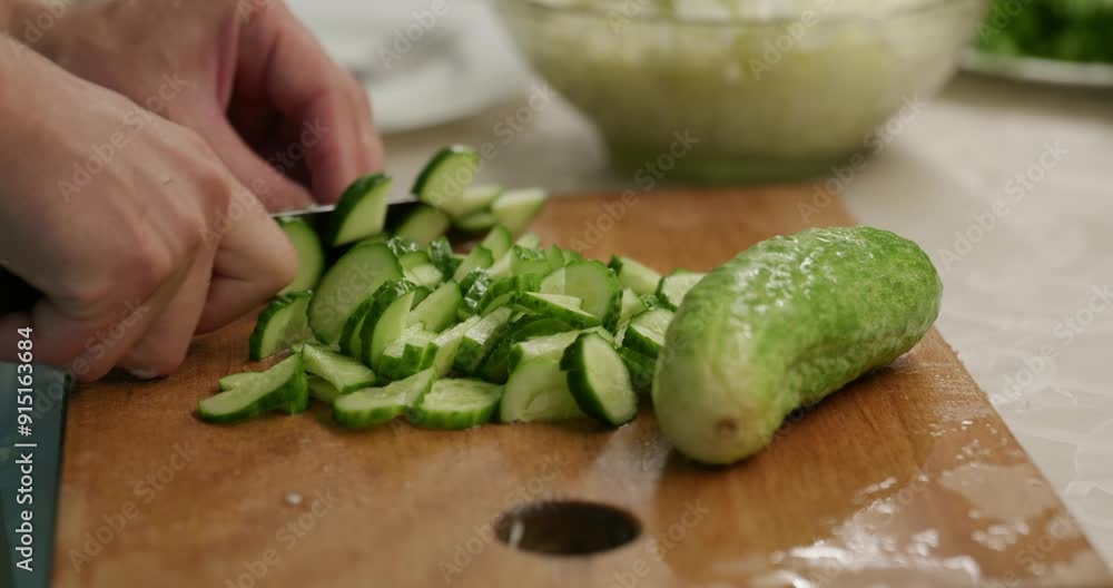 Male Hand with Knife Chop Cut Cucumber. Man Prepare Salad. Men Cook Food at Kitchen Preparing Breakfast. Slow motion 60fps 4K 10-bit Male Hand with Knife Chop Cut Cucumber. Man Prepare Salad. Men Cook Food at Kitchen Preparing Breakfast. Slow motion 60fps 4K 10-bit