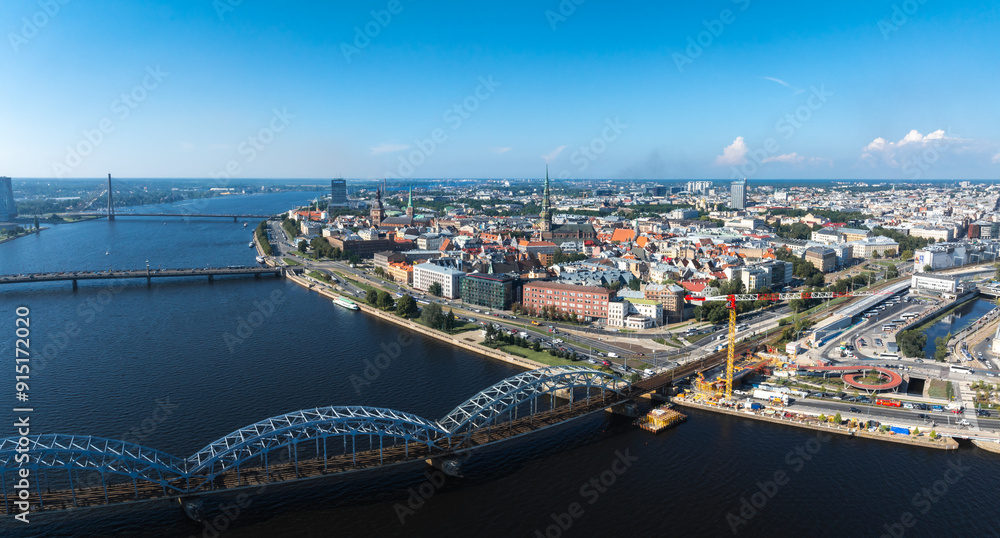 Aerial view of the Riga old town in Latvia. Riga Cityscape In Sunny Summer Day. Famous Landmark - Riga Dome Cathedral Aerial view of the Riga old town in Latvia. Riga Cityscape In Sunny Summer Day. Famous Landmark - Riga Dome Cathedral