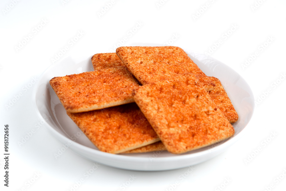 Fototapeta premium A stack of crackers with beef floss flavor. Isolated on white background. Perfect for design element, product packaging, promotion, or any commercial purposes.
