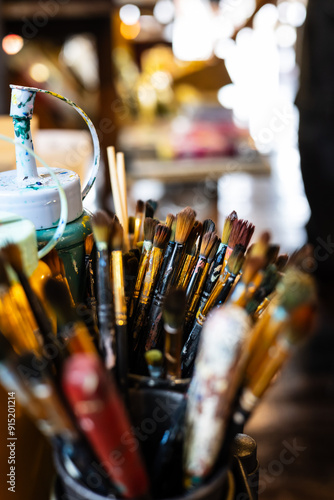 Wallpaper Mural Tools of the trade.  A pot full of colourful paintbrushes against a light blurred background. Torontodigital.ca