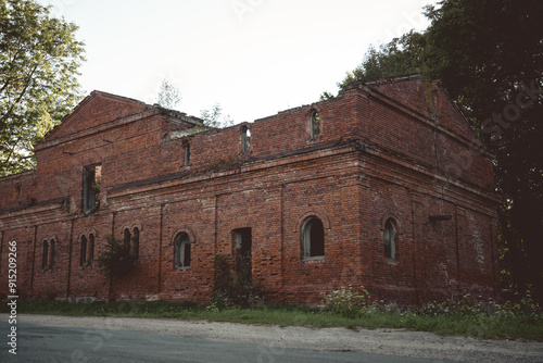 A dilapidated brick stable building. 19th century buildings