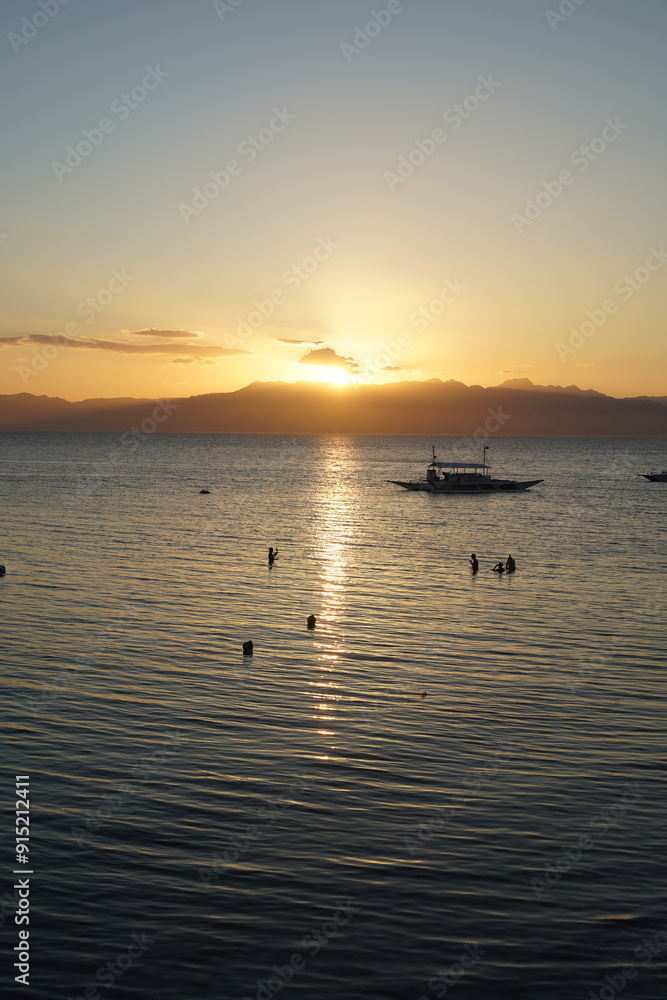 sunset over the sea in Moalboal, Cebu, Philippines sunset over the sea in Moalboal, Cebu, Philippines