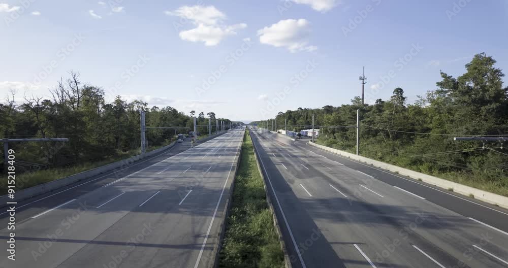 Time-lapse shot of a German highway with fast-moving vehicles Time-lapse shot of a German highway with fast-moving vehicles