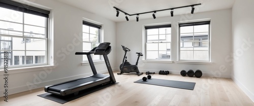 A modern, minimalistic home gym featuring a treadmill, exercise bike, and weights, ideal for fitness and wellness routines photo