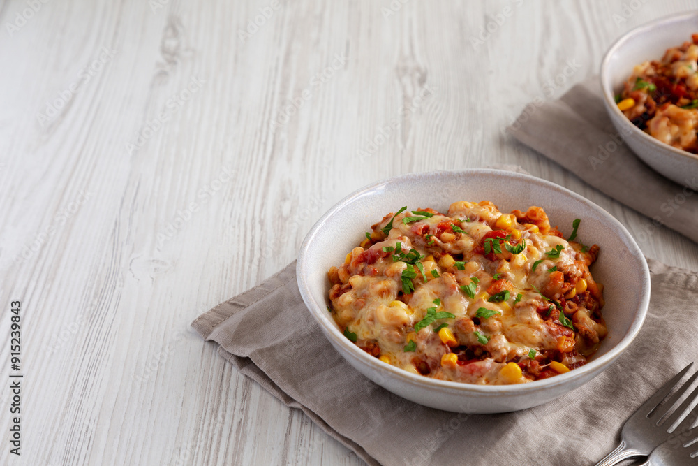 Homemade One-Pot Cheesy Taco Pasta in a Bowl, side view. Copy space. Homemade One-Pot Cheesy Taco Pasta in a Bowl, side view. Copy space.