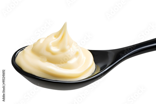 Spoon of mayonnaise isolated on white background