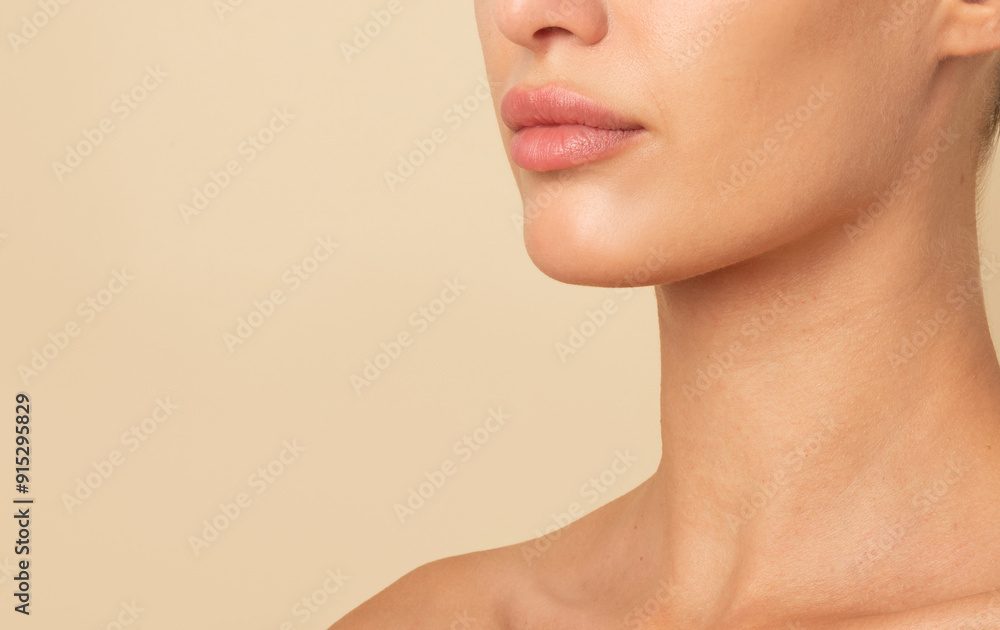 Woman with tender female neck, lips and chin posing isolated over beige studio background, free space. Concept of beauty, natural skin, cosmetics care, spa, plastic surgery Woman with tender female neck, lips and chin posing isolated over beige studio background, free space. Concept of beauty, natural skin, cosmetics care, spa, plastic surgery