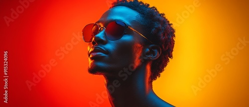 Stylish individual with sunglasses against vibrant colored background, showcasing modern aesthetic and confidence.