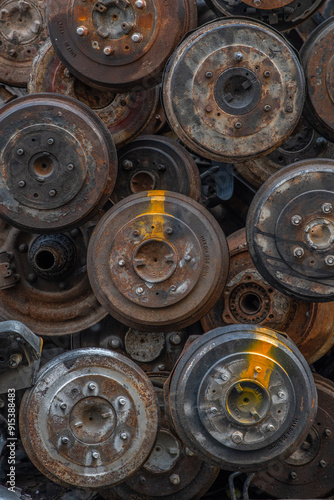 Wheel hubs that have been stripped from cars and waiting to be repurposed. Location was in Bangkok, Thailand outside the one of many similar self employed home industries. 