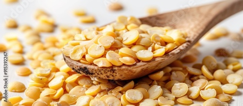 Yellow split peas in a spoo...