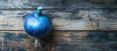 Vegan blue onion on a woode...