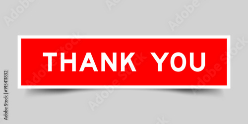 Square sticker label with word thank you in red color on gray background