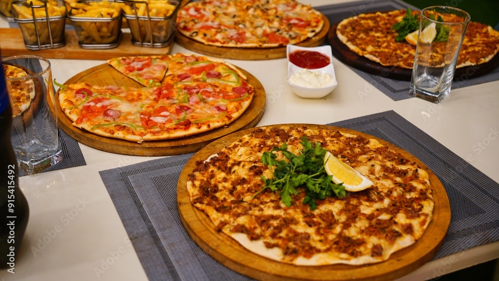 Assorted Pizza on White Tabletop Assorted Pizza on White Tabletop