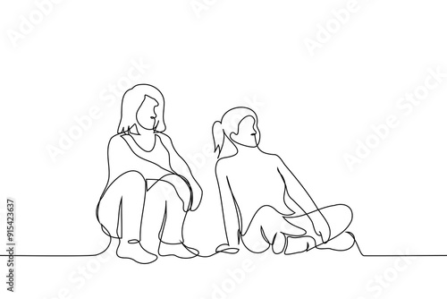 women sitting on the floor looking in one direction - one line art vector. concept female friends watching tv together or students on the grass