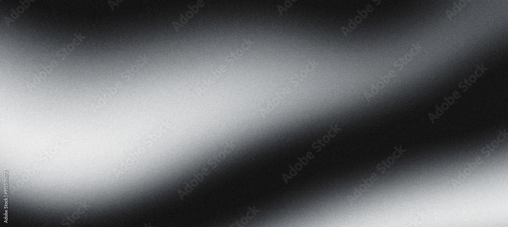 Grainy texture forming a black and white gradient on abstract background Grainy texture forming a black and white gradient on abstract background