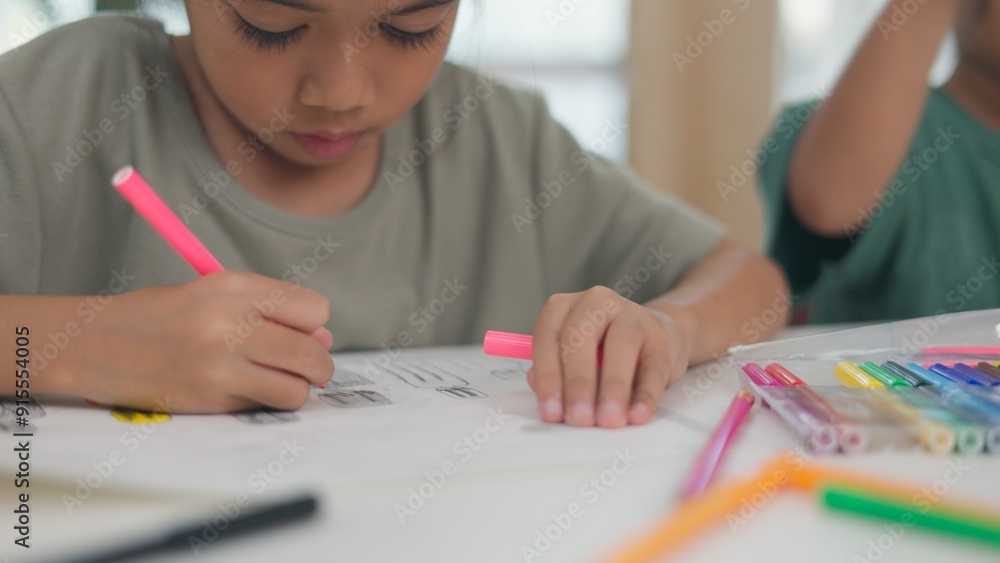 Two children are playing with a science experiment involving water Two children are playing with a science experiment involving water