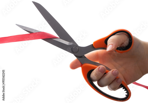 Cutting a red ribbon with scissors on a white background. Opening procedure, inauguration, new project.