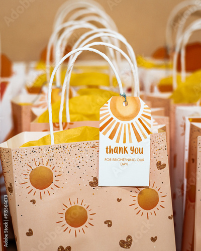 close up of colorful thank you bags on a table