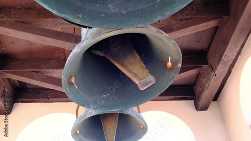 The great bell of a church rings loudly