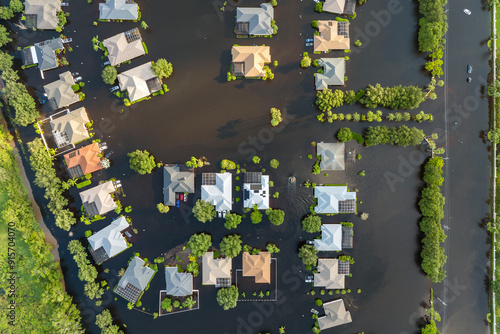 Flooding in Florida caused by tropical storm from hurricane Debby. Suburb houses in Laurel Meadows residential community surrounded by flood waters in Sarasota. Aftermath of natural disaster photo