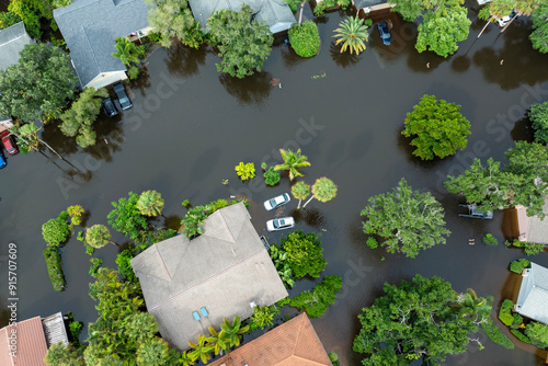 Hurricane Debby tropical rainstorm flooded residential homes and cars in suburban community in Sarasota, Florida. Aftermath of natural disaster photo