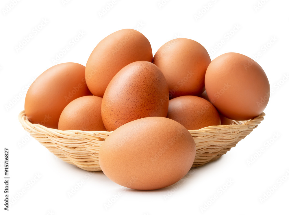 Front view of fresh brown chicken eggs in stack in wicker basket isolated on white background with clipping path Front view of fresh brown chicken eggs in stack in wicker basket isolated on white background with clipping path