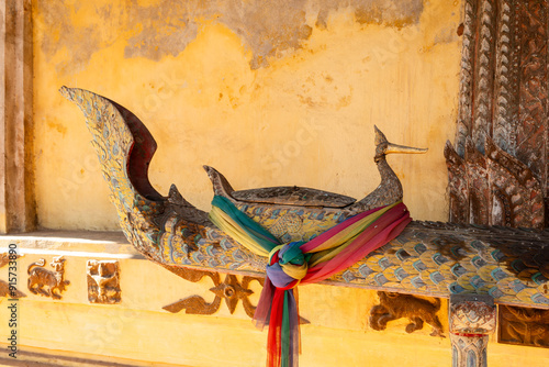 Buddhist wooden gutter for watering Buddha statues during Lao New Year in Wat Si Saket features in Vientiane, Laos photo