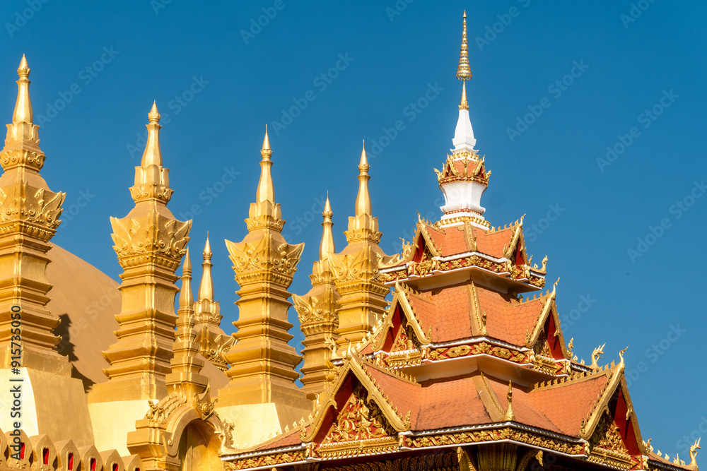 Fototapeta premium of The stupa of Pha That Luang a large, gold-covered Buddhist stupa and a national symbol in the center of the city of Vientiane, capital of Laos.