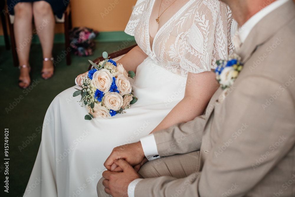 A close-up of a bride holding a bouquet, with her partner's hand gently resting beside hers. Perfect for wedding or love-themed visuals.