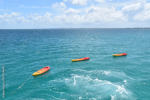 Sailing on the crystal clear turqoise blue water around the white sand beaches of Fraser Island in Queensland, Australia photo