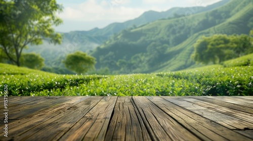 Wooden surface with blurred green tea mountain and grass field, depicting a fresh and relaxing theme for product display or design layout with open space for text.