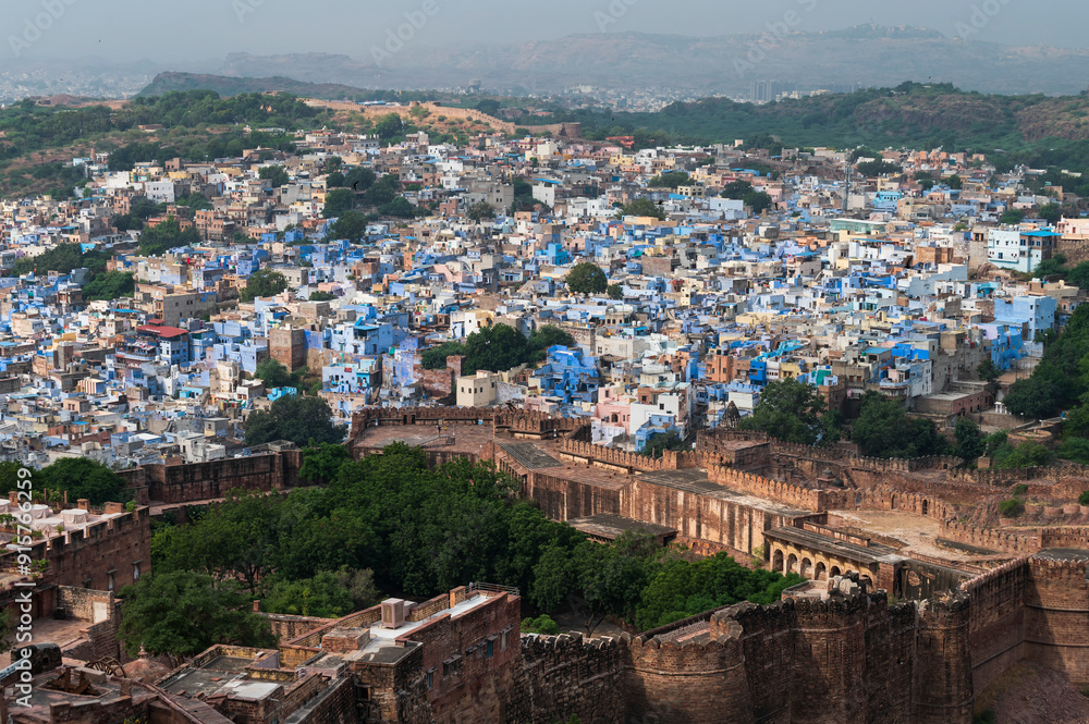 Fototapeta premium Beautiful top view of Jodhpur city from Mehrangarh fort, Rajasthan, India. Jodhpur is called Blue city since Hindu Brahmis there worship Lord Shiva, whose colour is blue, they painted houses in blue.