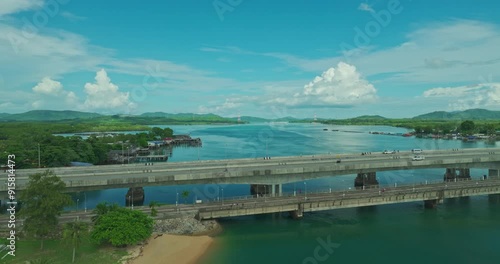 aerial view blue sea White cloud in blue sky above Sarasin bridge viewpoint. Sarasin bridge is an important route connecting by land.
Sarasin bridge connect Phuket island to Phang Nga province. photo