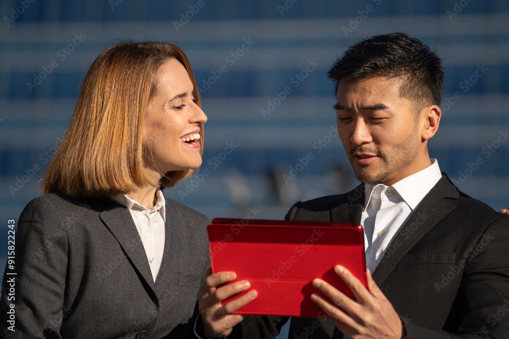 Close up headshot of two business colleagues discussing a corporate project outdoors Close up headshot of two business colleagues discussing a corporate project outdoors