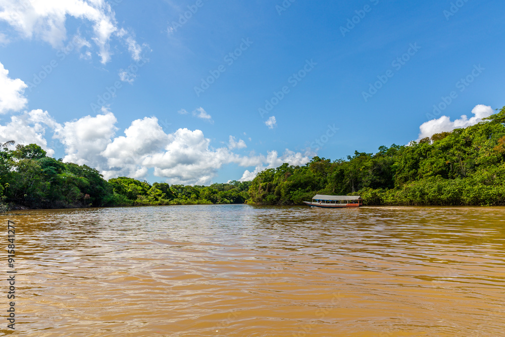 Navigating the Amazon River. In the Amazon jungle, near Iquitos, Peru. South America. Navigating the Amazon River. In the Amazon jungle, near Iquitos, Peru. South America.