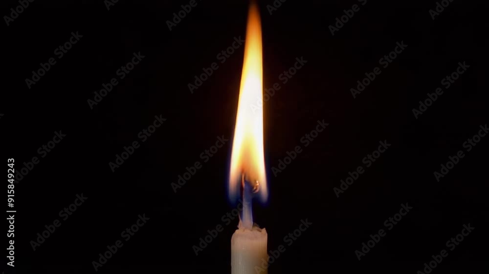 Single Candle Flame Isolated on Black Background Single Candle Flame Isolated on Black Background