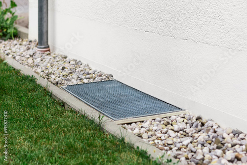 Картината върху платно Drain Stones Pebbles Floor with Downspout and Grate of Drainage System Outdoor