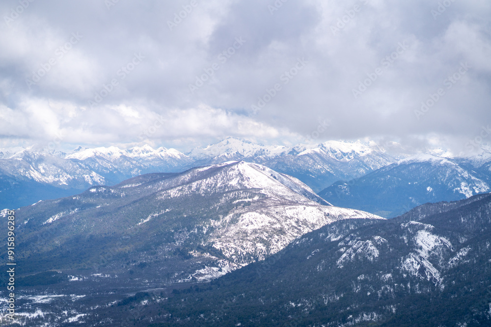 Obraz premium aerial view over trail in Patagonia mountains in San Martín de los Andes in summer with snow