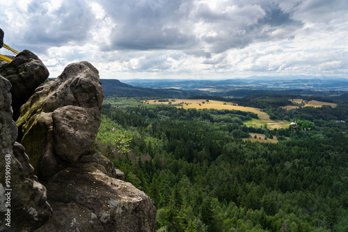 a winch in the mountains to supply the shelter, coins scattered on the rocks to symbolize happiness. A view of the surrounding forest and the Sudetes. Discover the Stolowe Mountains photo