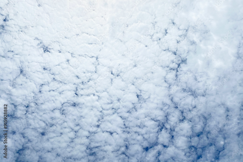 Blue sky background with tiny clouds. Abstract nature background with copy space. Blue sky background with tiny clouds. Abstract nature background with copy space.