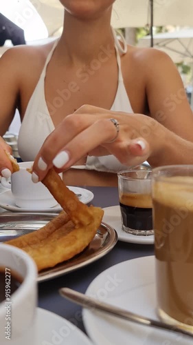 Woman enjoying breakfast in a restaurant terrace in Spain