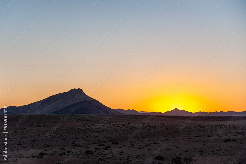Impression of the Sunrise in the Namibian Desert near cha-re. Impression of the Sunrise in the Namibian Desert near cha-re.