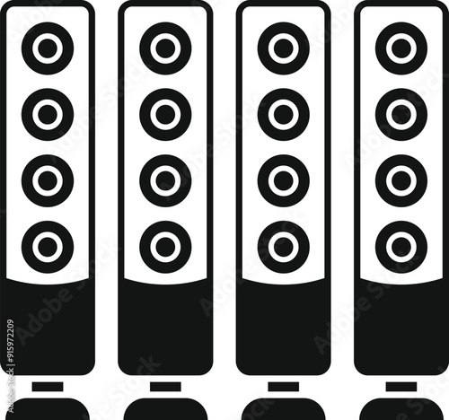 Four tall loudspeakers standing on the floor, delivering powerful sound