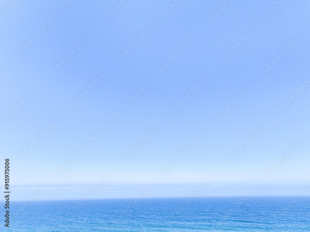 The ocean meets the sky in a perfect blend of blue The ocean meets the sky in a perfect blend of blue