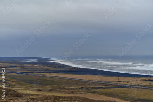 Ocean waves crashing on black sand beach in iceland