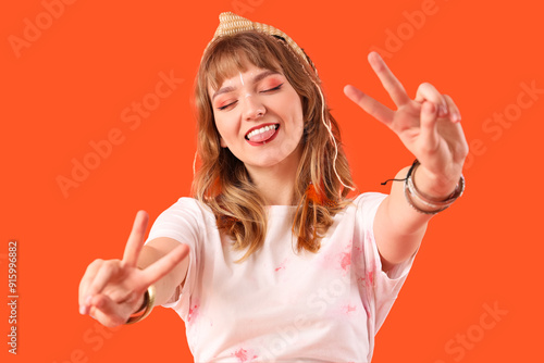 Female hippie showing victo...