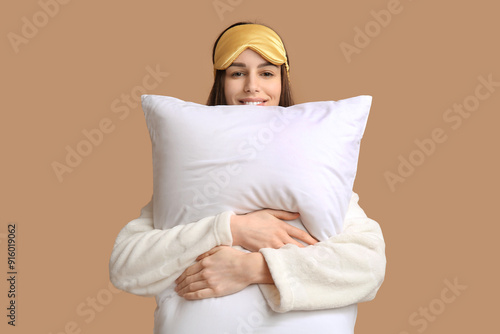 Young woman in pajamas and ...