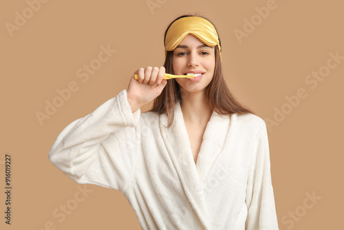 Young woman in pajamas and ...